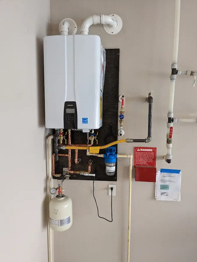 Professional plumber installing copper piping in a Fishkill home